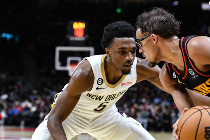 New Orleans Pelicans forward Herb Jones (5) pressures Atlanta Hawks guard Trae Young (11) in the third quarter at State Farm Arena.